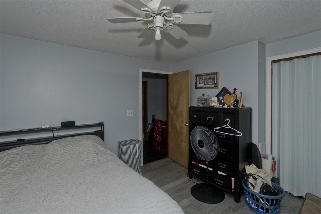 37-39 Porter Street Springfield, MA 01104 - Photo 31 of 40 a bedroom with bed and a chandelier