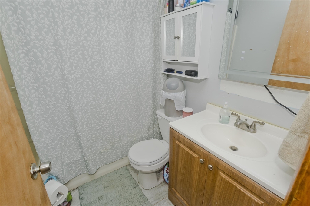 37-39 Porter Street Springfield, MA 01104 - Photo 33 of 40 a bathroom with a sink a toilet and shower