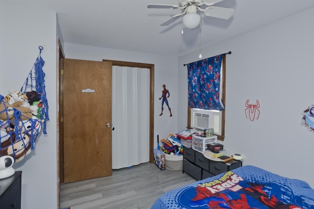 37-39 Porter Street Springfield, MA 01104 - Photo 35 of 40 a bedroom with furniture and a window