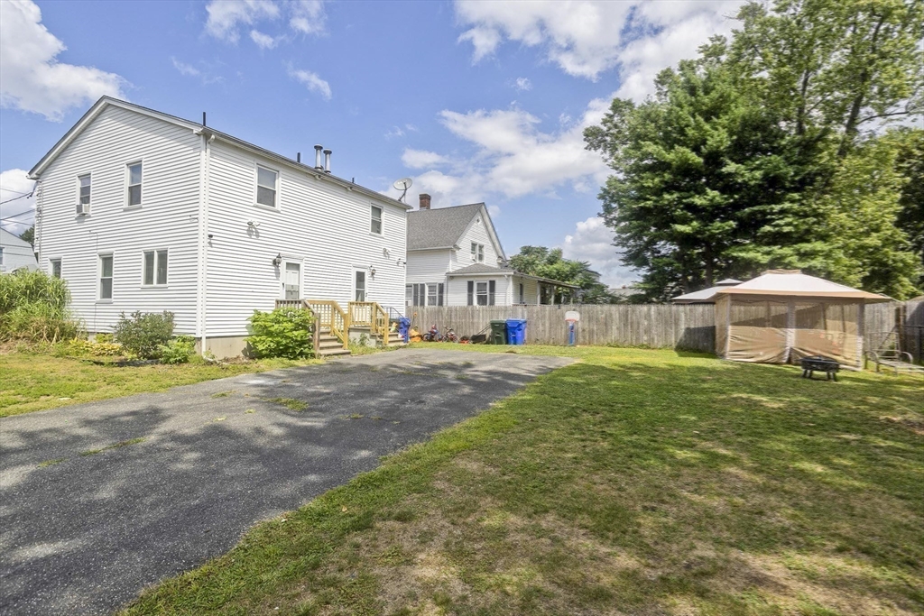 37-39 Porter Street Springfield, MA 01104 - Photo 37 of 40 a front view of a house with a yard and garage