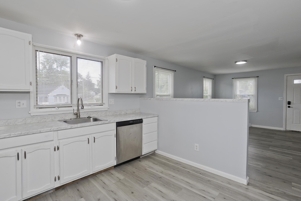37-39 Porter Street Springfield, MA 01104 - Photo 9 of 40 a kitchen with sink and cabinets