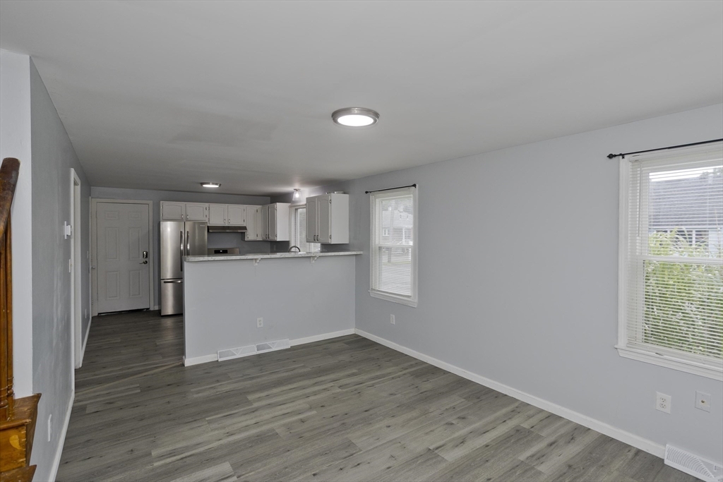 37-39 Porter Street Springfield, MA 01104 - Photo 10 of 40 a view of a kitchen with wooden floor and a window
