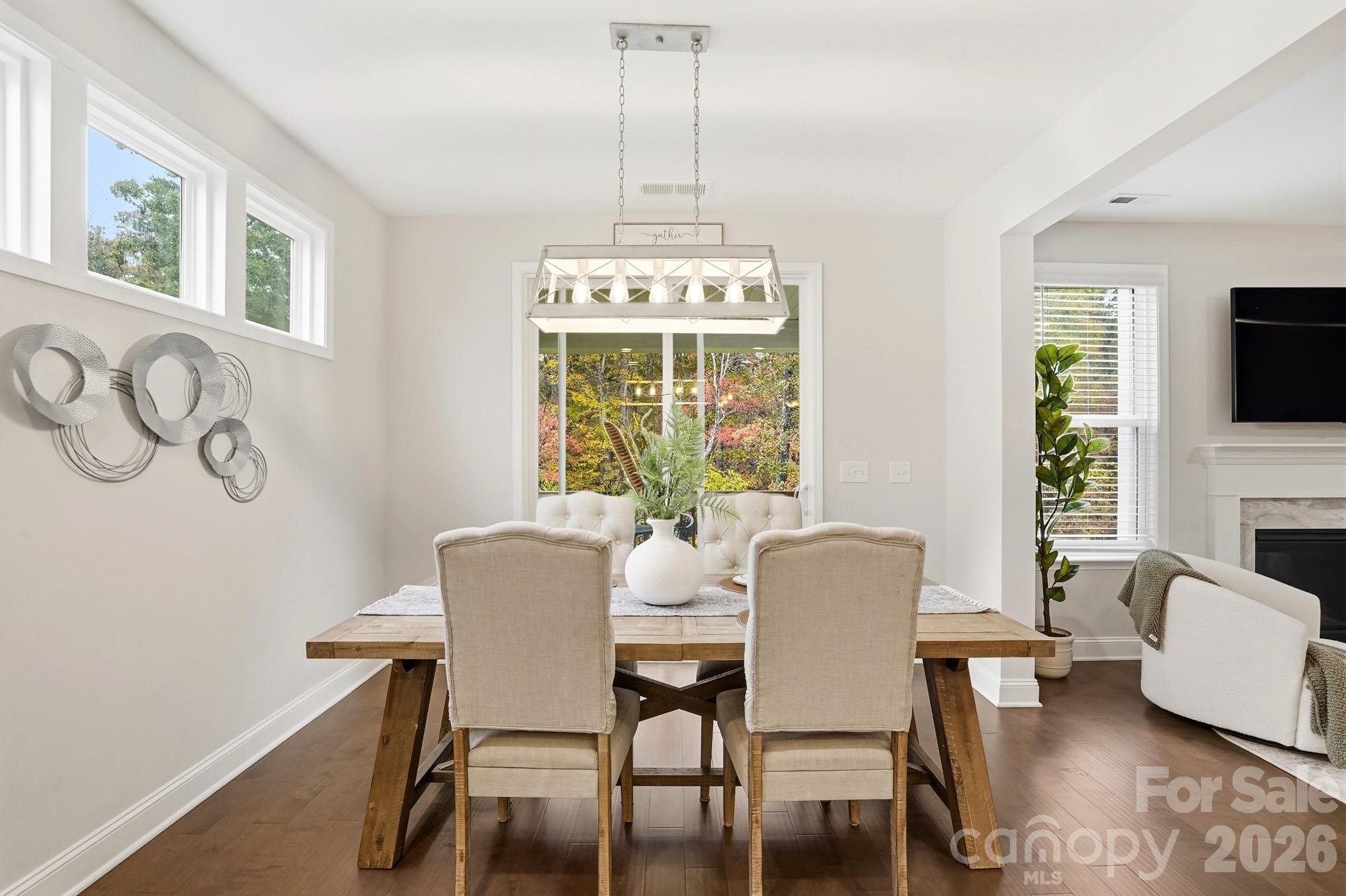 4044 Brandywine Terrace Lancaster, SC 29720 - Photo 20 of 48 a dining room with furniture a chandelier and wooden floor