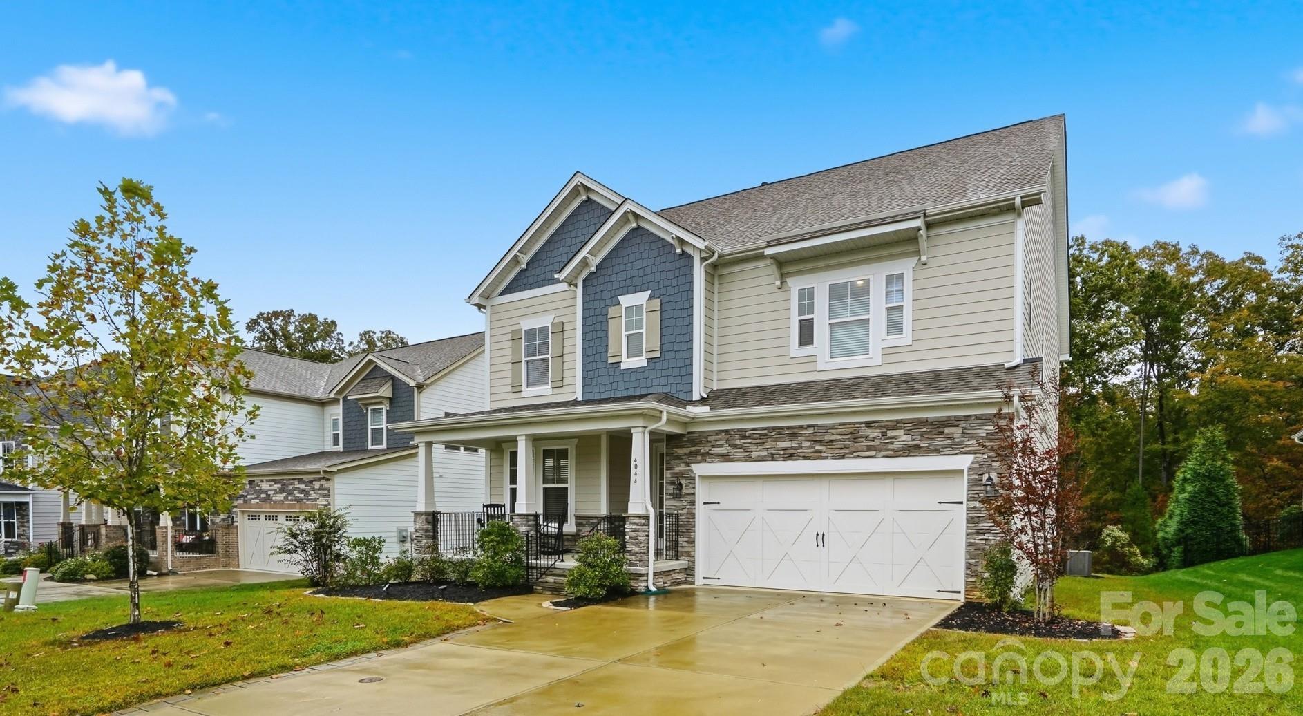 4044 Brandywine Terrace Lancaster, SC 29720 - Photo 2 of 48 a view of a white house with a yard and plants