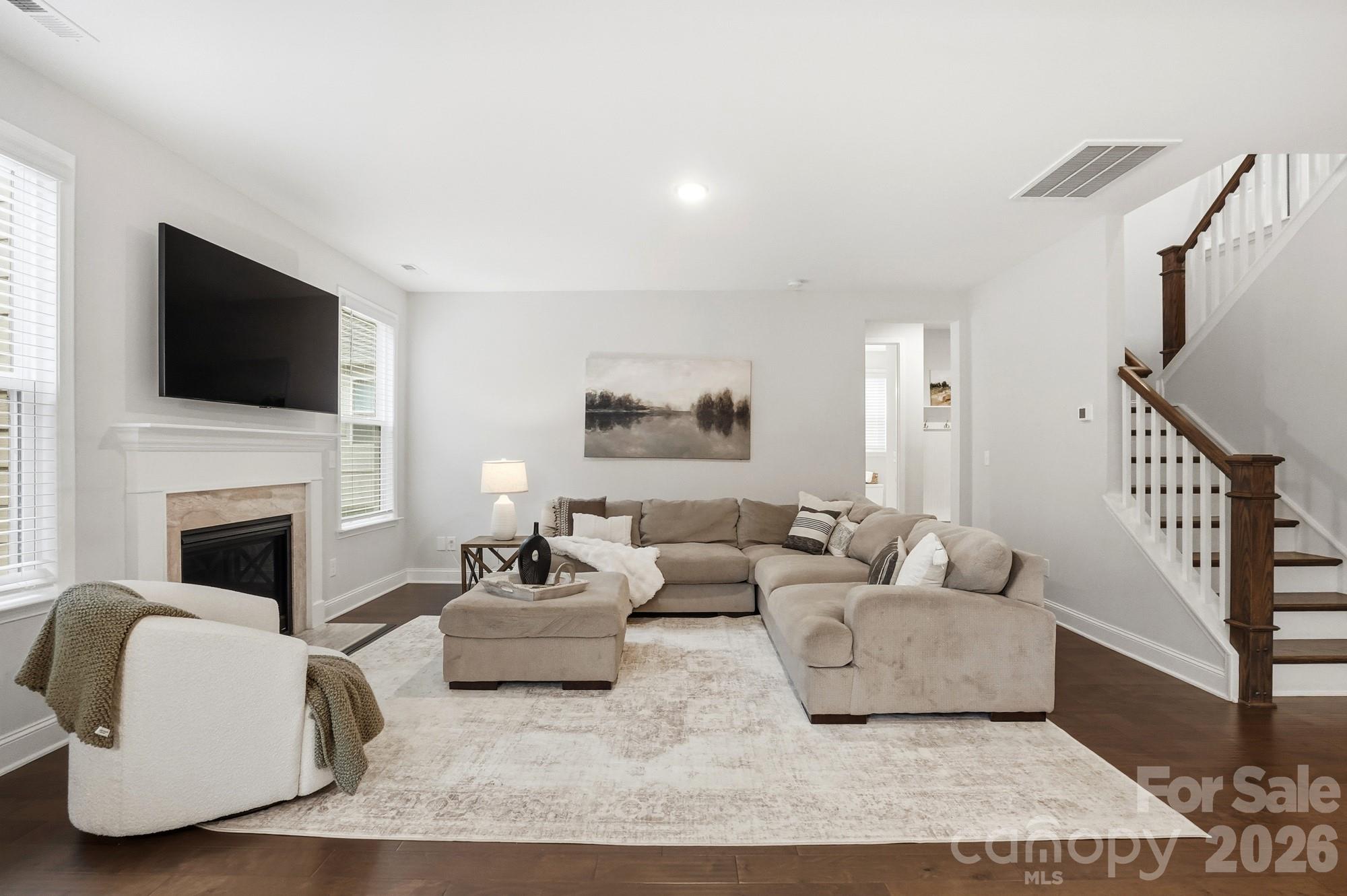 4044 Brandywine Terrace Lancaster, SC 29720 - Photo 23 of 48 a living room with furniture a flat screen tv and a fireplace