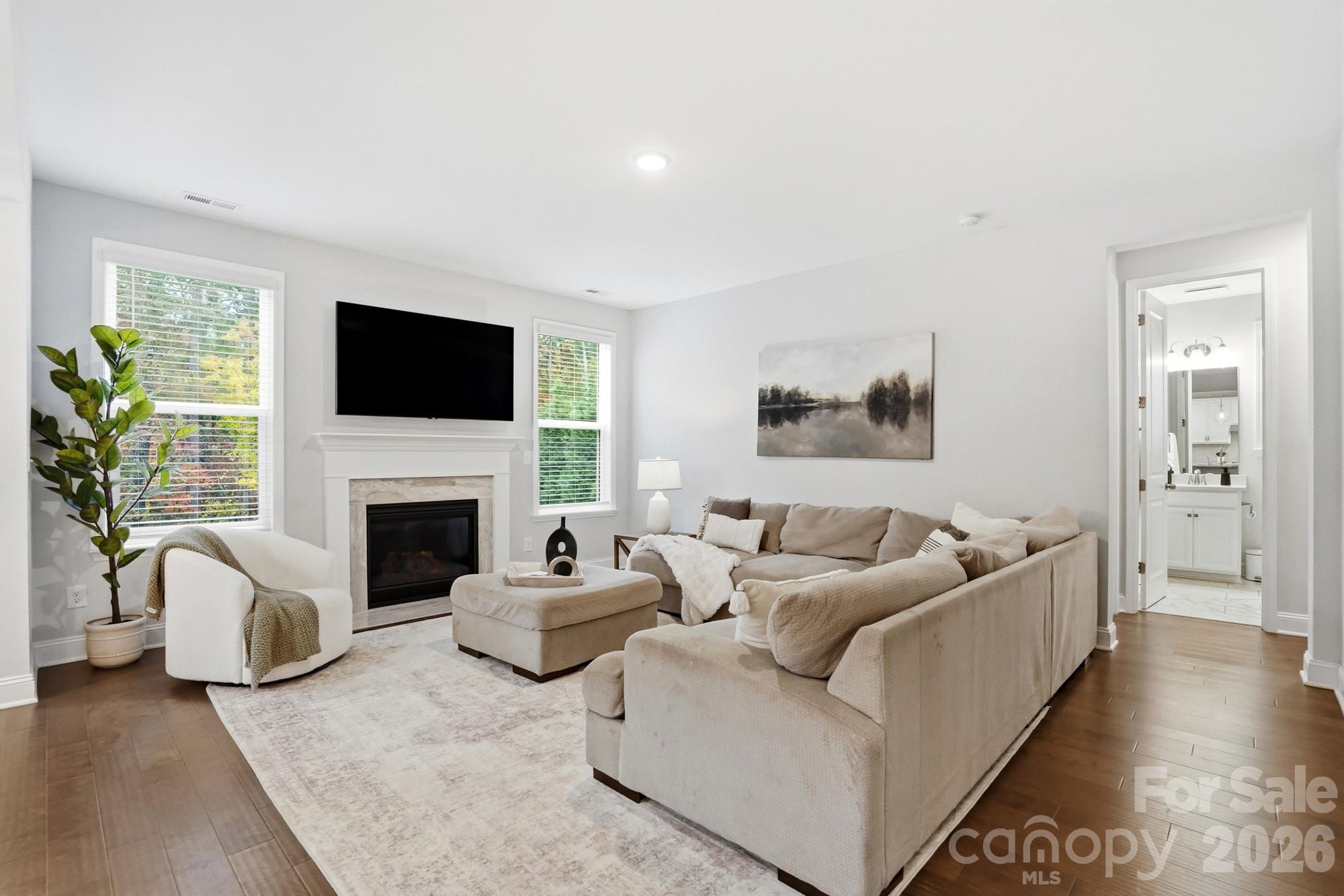4044 Brandywine Terrace Lancaster, SC 29720 - Photo 24 of 48 a living room with furniture a flat screen tv and a fireplace