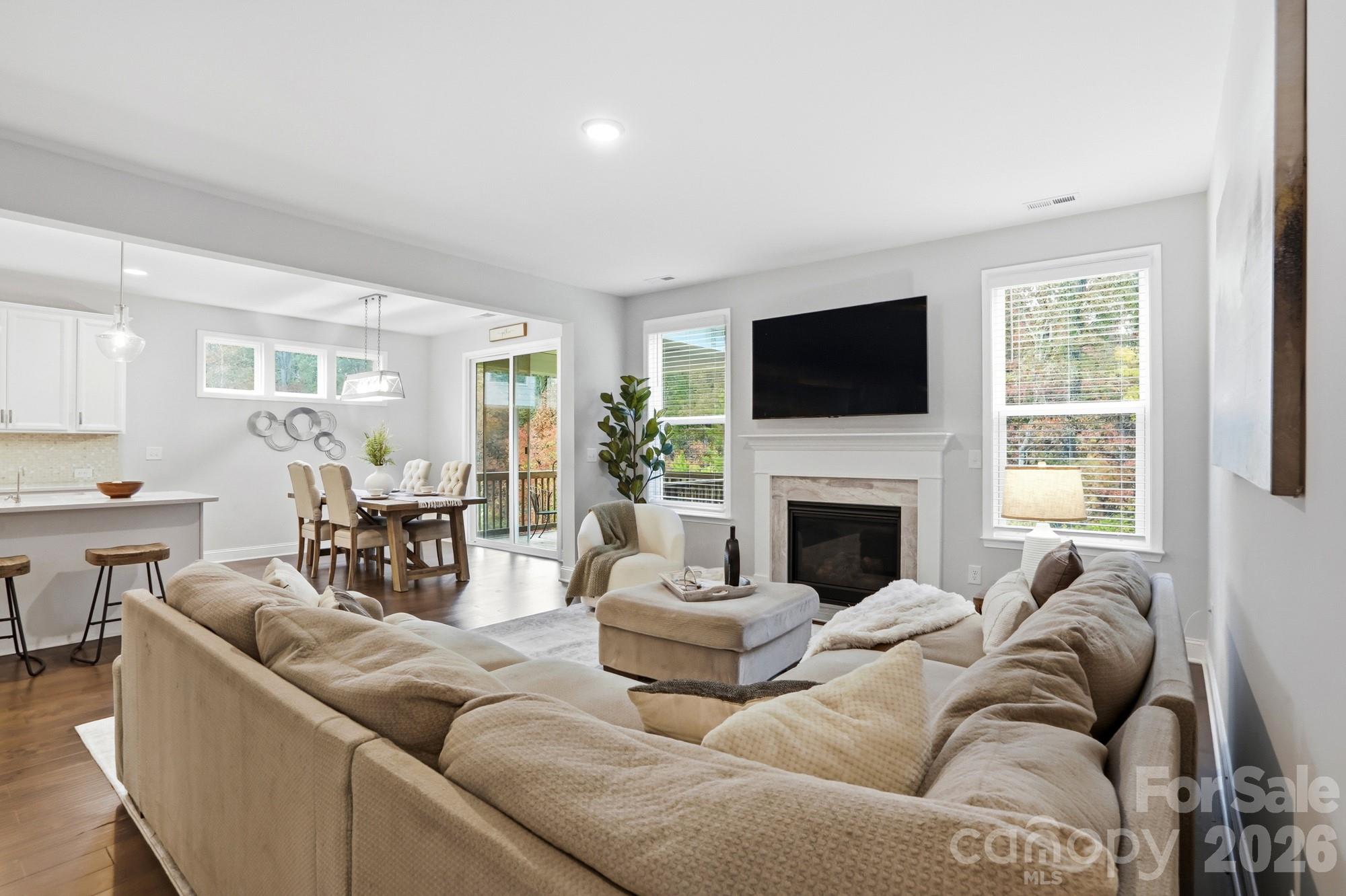 4044 Brandywine Terrace Lancaster, SC 29720 - Photo 25 of 48 a living room with furniture a fireplace and a flat screen tv
