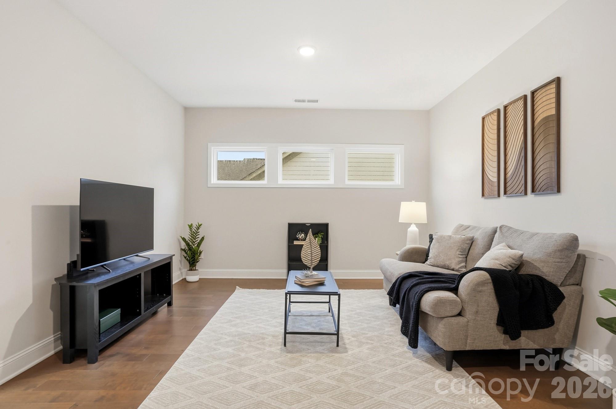 4044 Brandywine Terrace Lancaster, SC 29720 - Photo 31 of 48 a living room with furniture and a flat screen tv