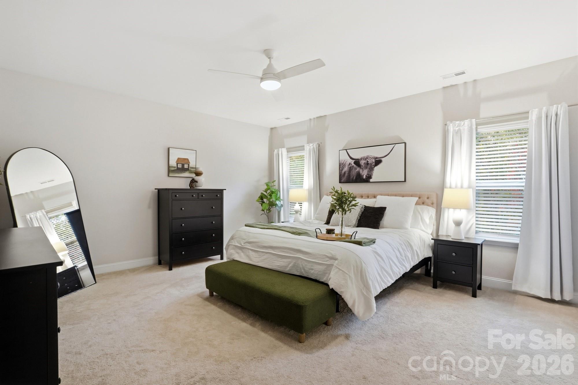 4044 Brandywine Terrace Lancaster, SC 29720 - Photo 33 of 48 a spacious bedroom with a bed and a chandelier