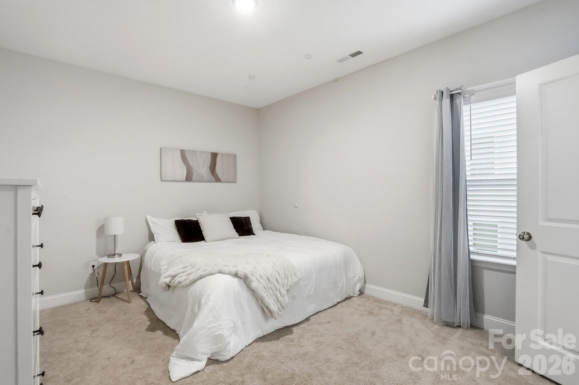 4044 Brandywine Terrace Lancaster, SC 29720 - Photo 39 of 48 a bedroom with a bed and a window