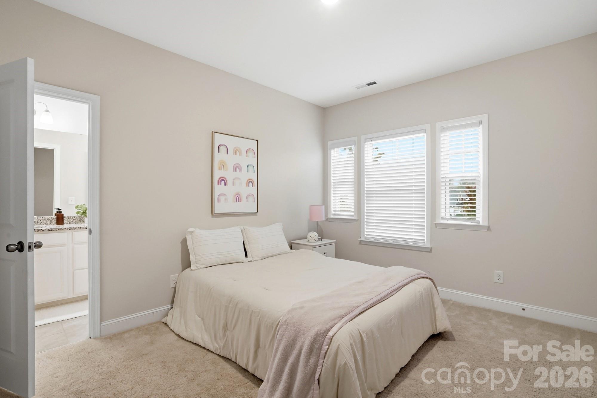 4044 Brandywine Terrace Lancaster, SC 29720 - Photo 41 of 48 a bedroom with a large bed and a window