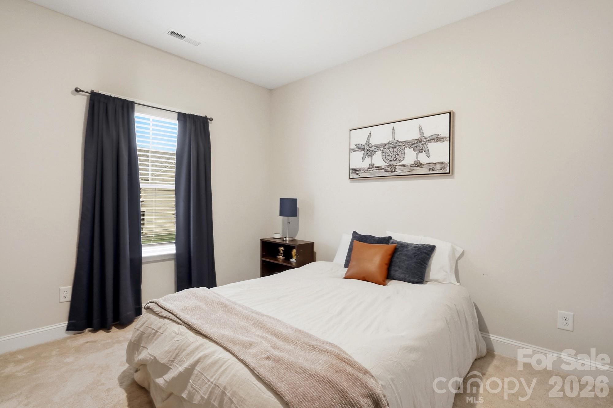 4044 Brandywine Terrace Lancaster, SC 29720 - Photo 42 of 48 a bedroom with a bed and a window