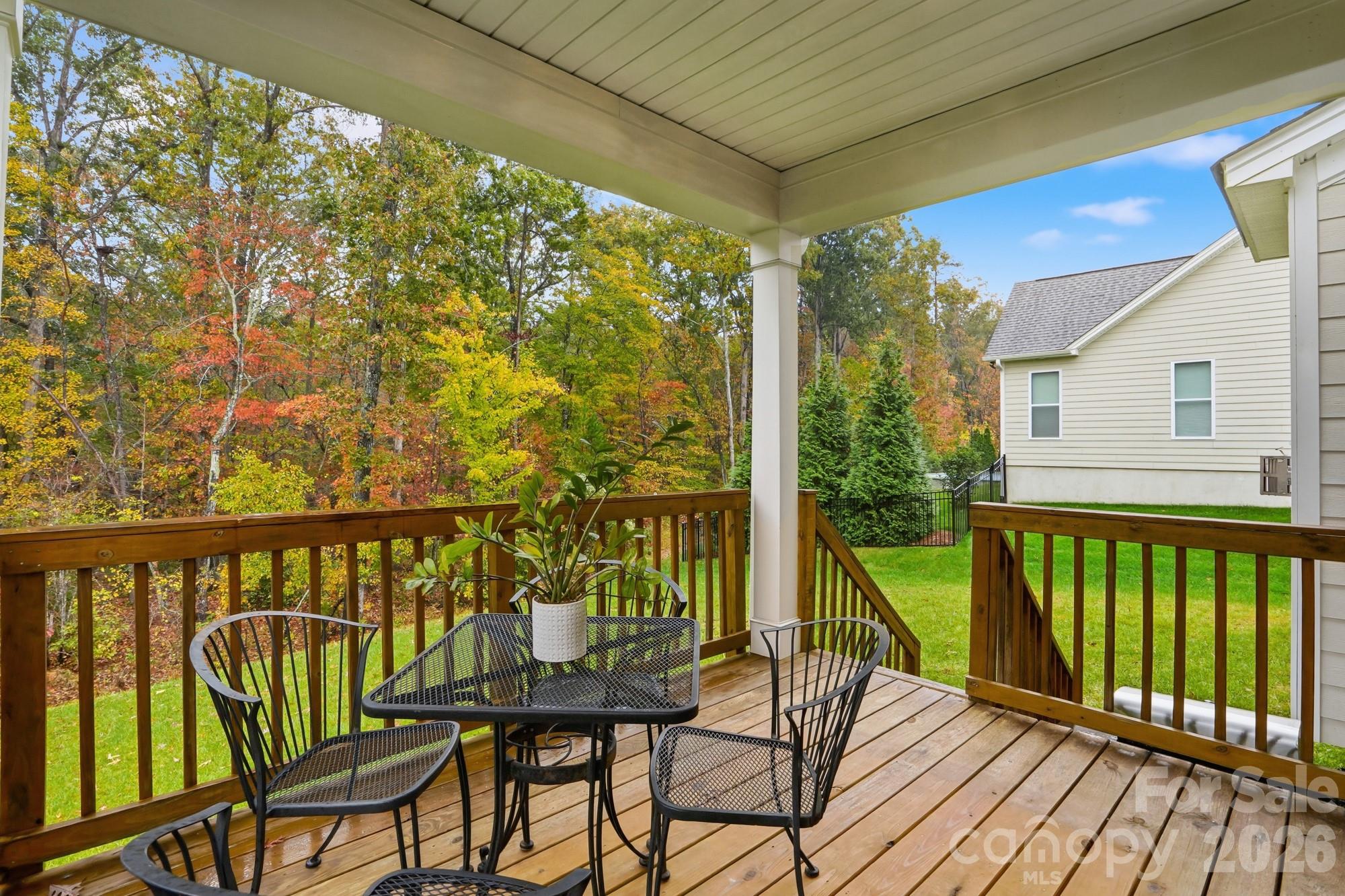 4044 Brandywine Terrace Lancaster, SC 29720 - Photo 44 of 48 a view of a balcony with chairs and wooden floor