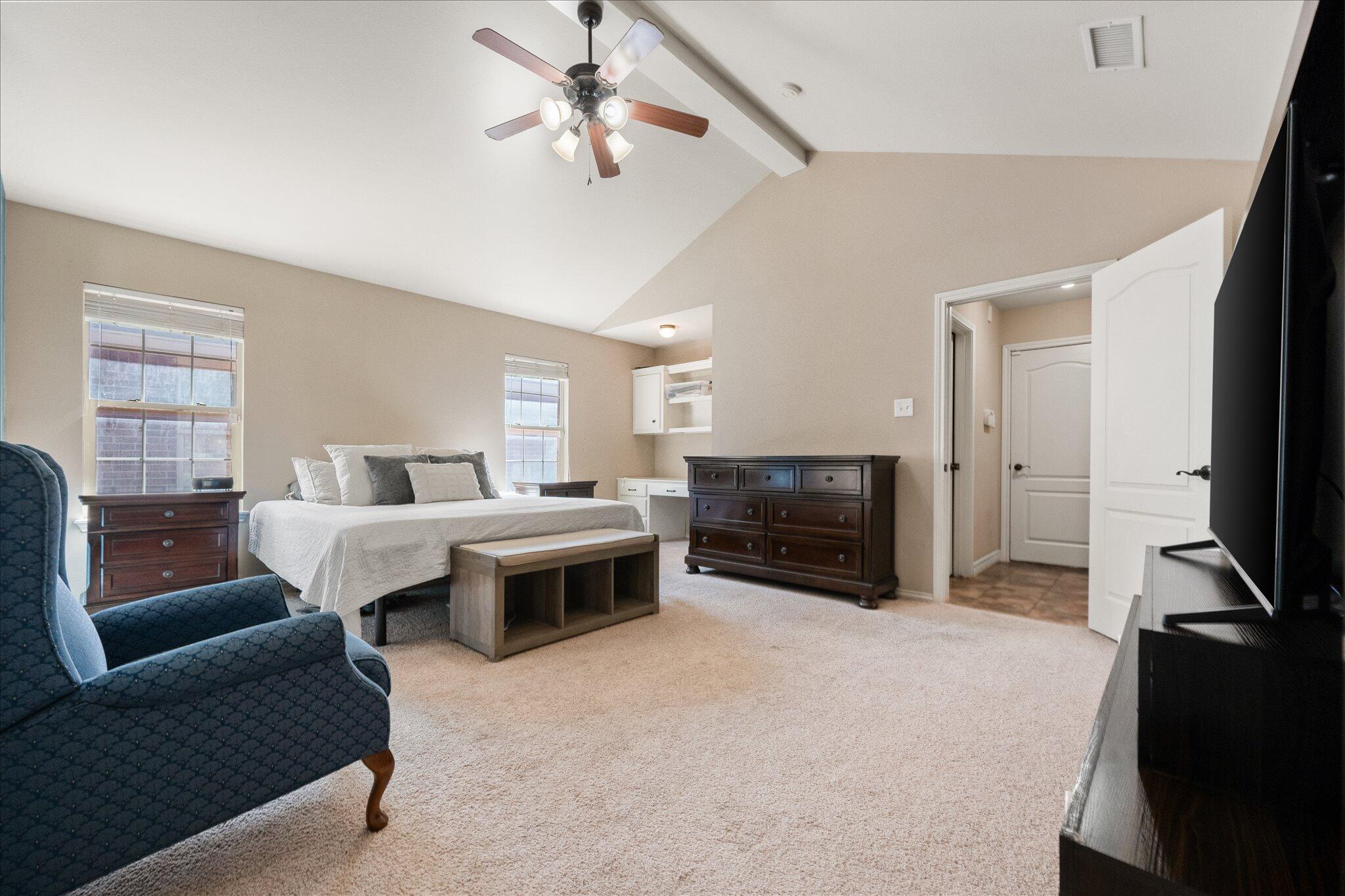 5704 107th Street Lubbock, TX 79424 - Photo 18 of 36 a living room with furniture and a flat screen tv