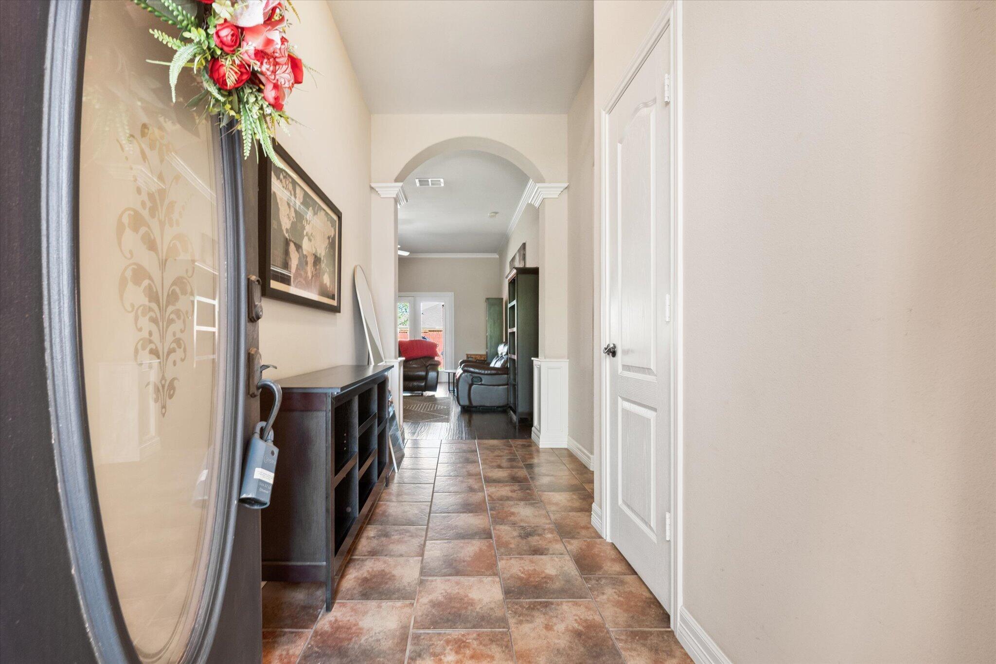 5704 107th Street Lubbock, TX 79424 - Photo 6 of 36 a view of a hallway with a flower pot