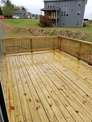 a view of balcony with wooden floor