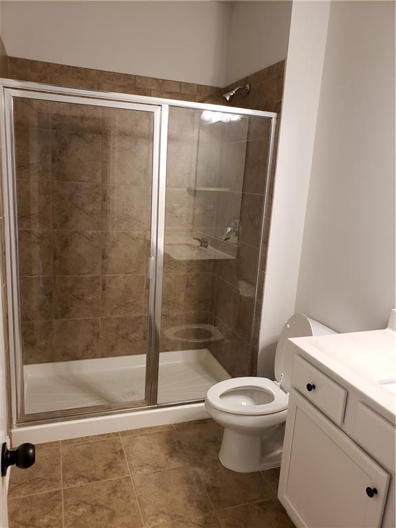 4735 Watkins Way Cumming, GA 30040 - Photo 22 of 31 a bathroom with a shower a toilet and a sink