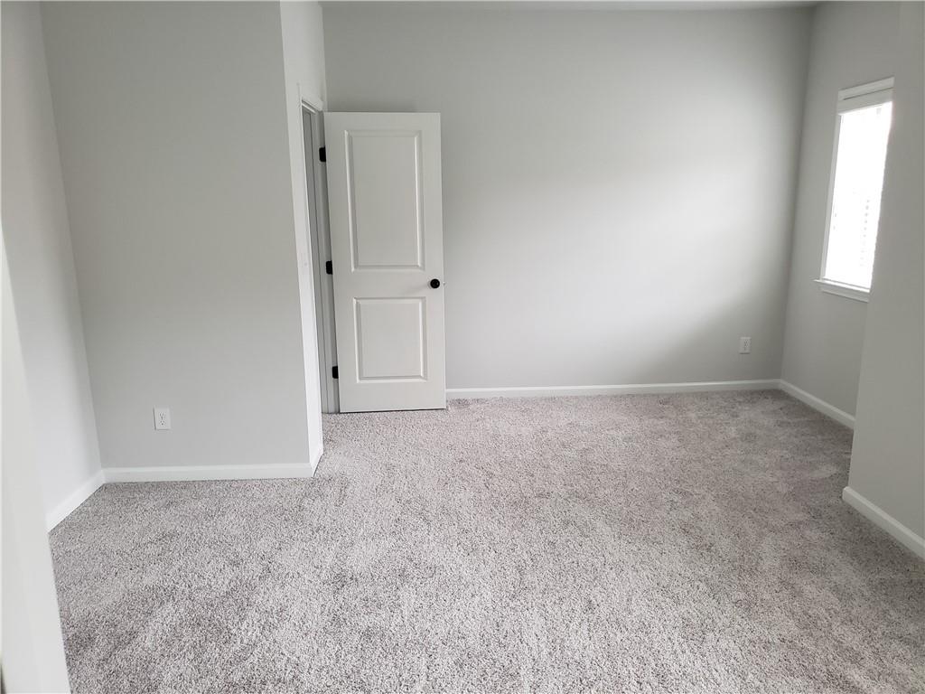 4735 Watkins Way Cumming, GA 30040 - Photo 23 of 31 an empty room with windows and closet