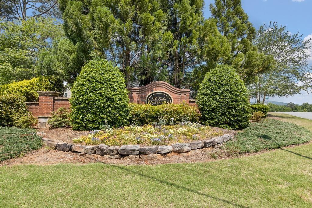 4735 Watkins Way Cumming, GA 30040 - Photo 26 of 31 a backyard of a house with a yard and outdoor seating