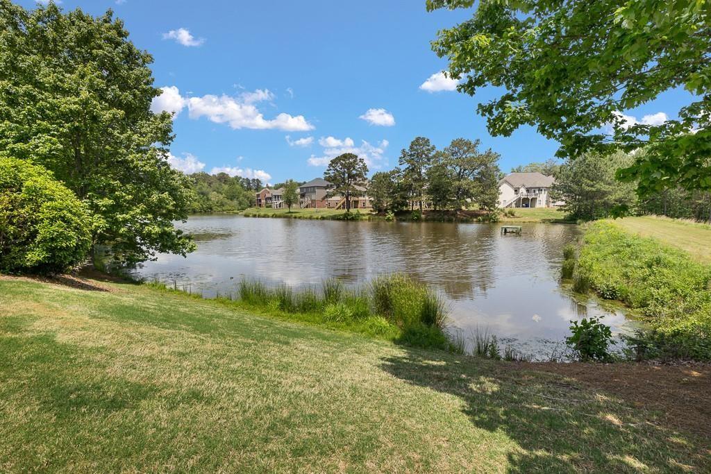 4735 Watkins Way Cumming, GA 30040 - Photo 30 of 31 a view of a lake with houses