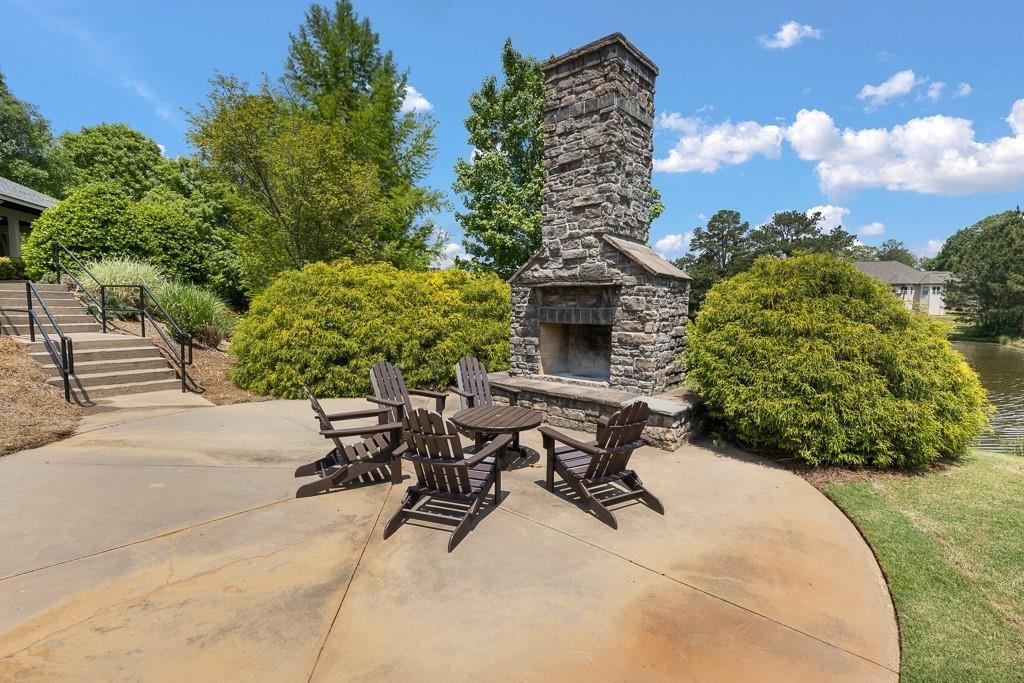 4735 Watkins Way Cumming, GA 30040 - Photo 31 of 31 a view of a backyard with plants and a patio
