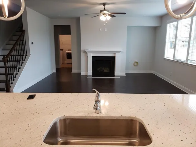 a kitchen with a sink and a microwave