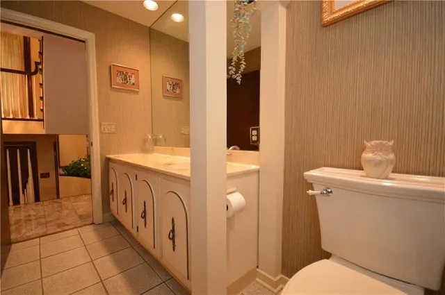 a living room with furniture a flat screen tv and a large window