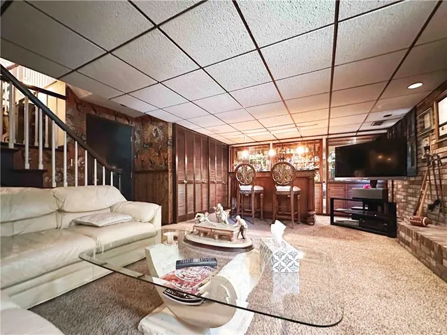 a view of a room with chairs and furniture