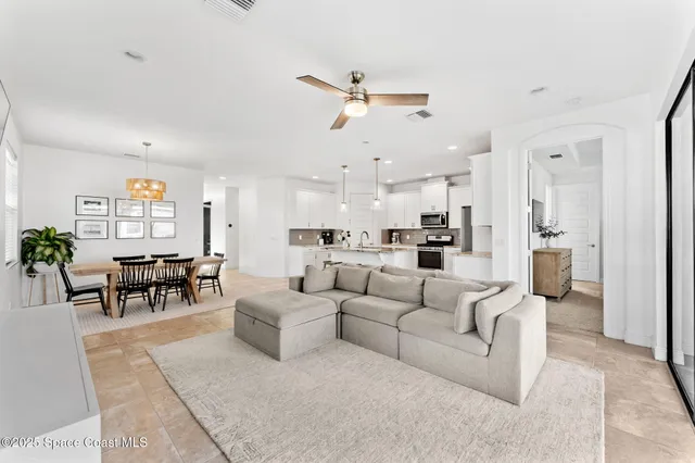 a living room with furniture white walls and white walls