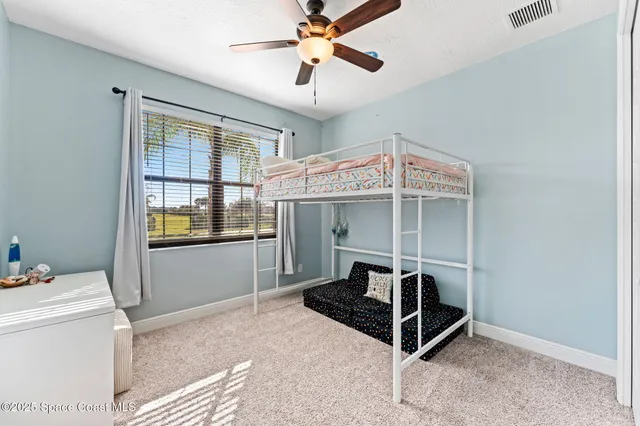 a room with furniture and chandelier