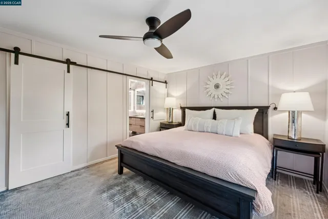 a bed in a room next to a window