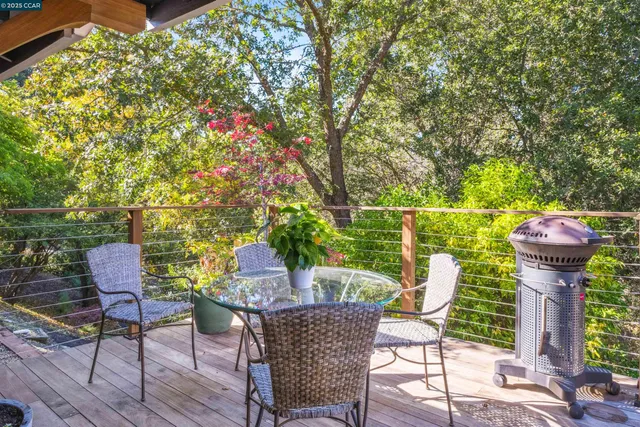 a dining room with furniture a window and wooden floor