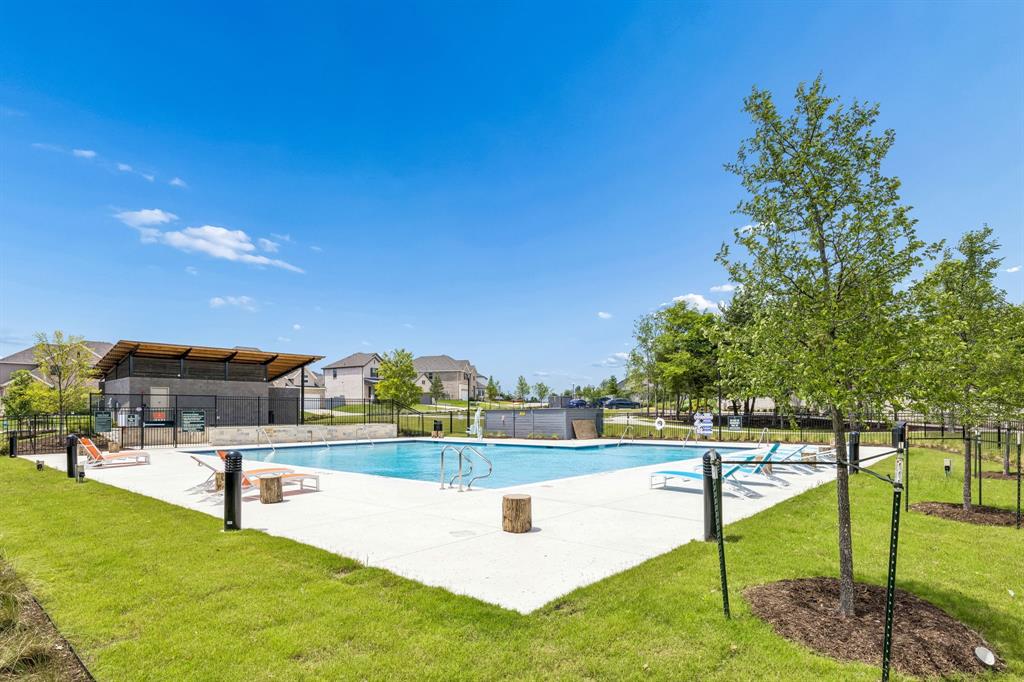 3004 Windy Rdg Road McKinney, TX 75071 - Photo 35 of 40 a view of a swimming pool with an outdoor seating