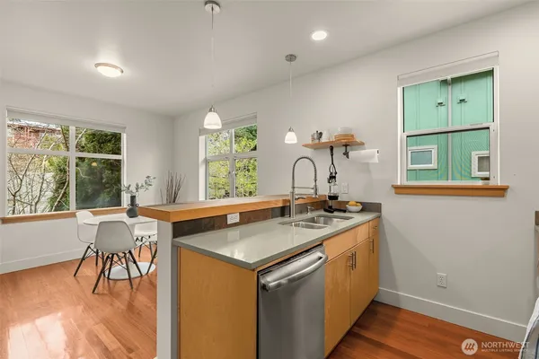 a view of a kitchen counter space and a sink