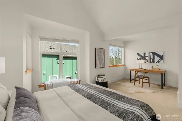 a bedroom with a bed and a couch