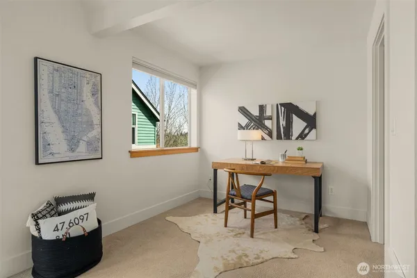 a view of a workspace with furniture