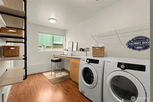 a view of livingroom with washer and dryer