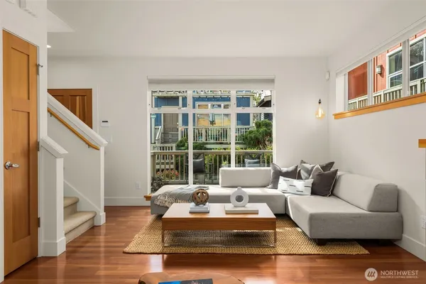 a living room with furniture and a large window