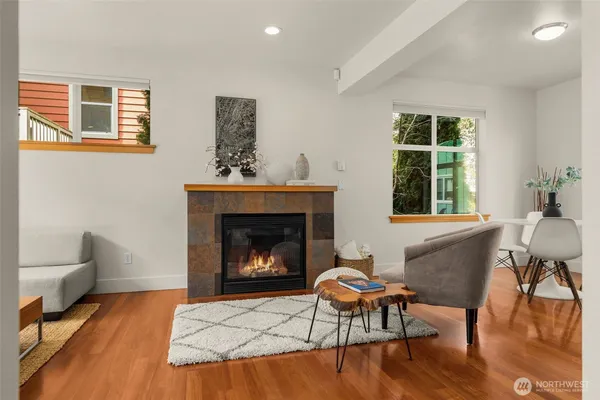 a living room with furniture and a fireplace