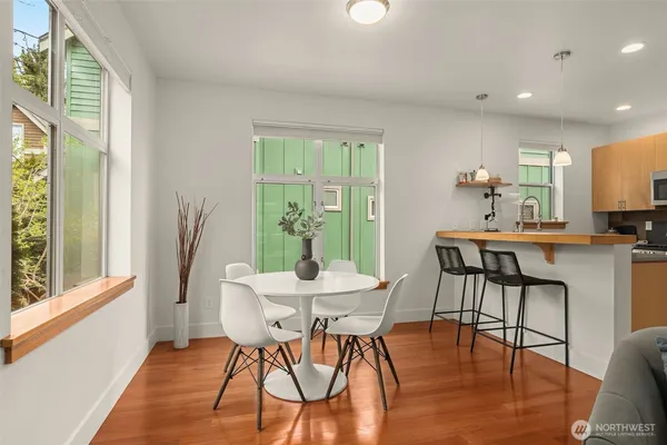 a view of a dining room with furniture window and outside view