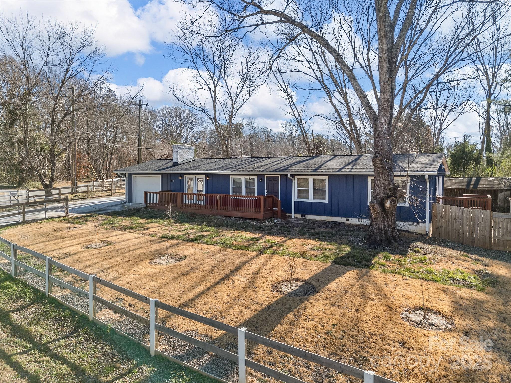 a view of a house with snow on the yard