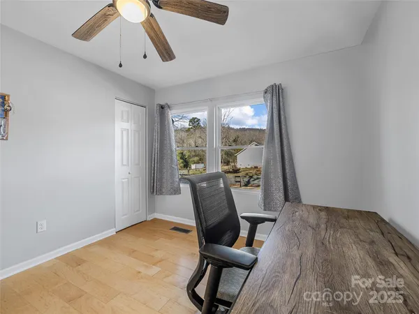 a view of a room with furniture window and wooden floor