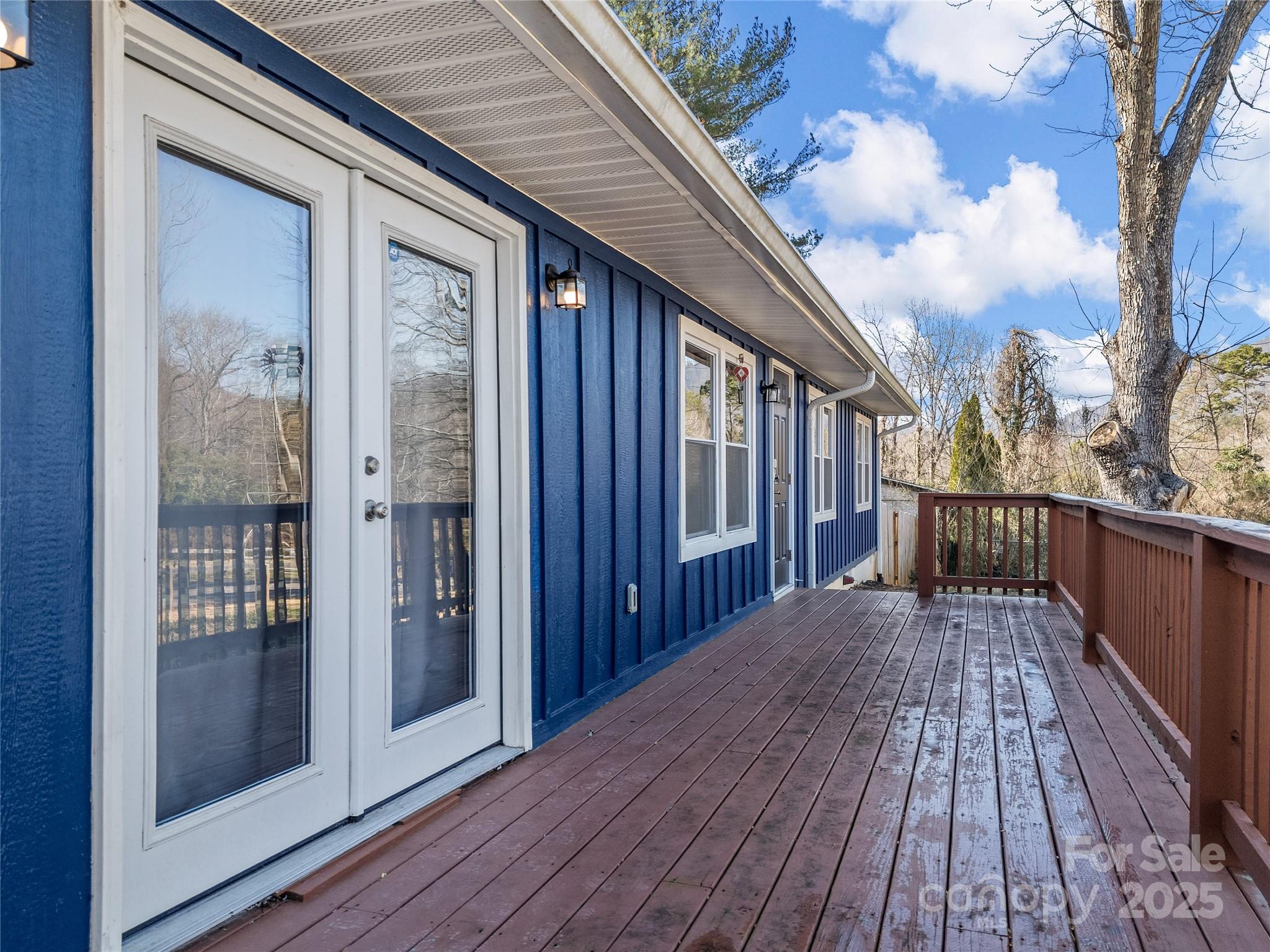 435 Thermal View Drive Tryon, NC 28782 - Photo 3 of 32 a view of a house on wooden deck