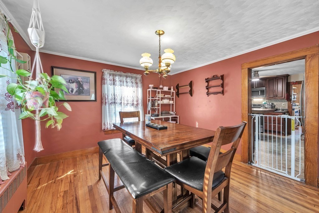 41 Spring Street Warren, MA 01092 - Photo 7 of 42 a dining room with furniture potted plants and wooden floor