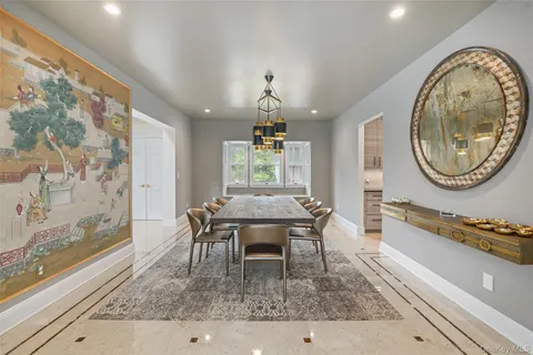 a living room with furniture a fireplace and a table