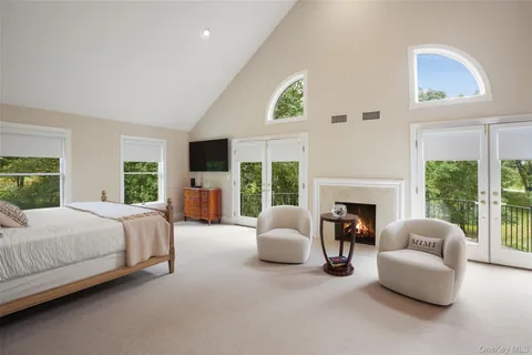 a spacious bathroom with a granite countertop sink mirror and toilet