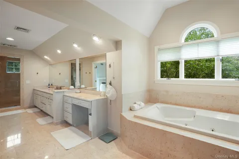 a bedroom with a bed wooden floor and window