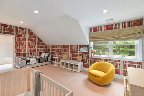 a front view of a house with swimming pool having outdoor seating