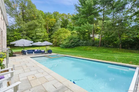 an aerial view of a house with garden space patio and outdoor seating