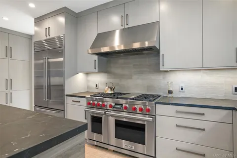 a kitchen with stainless steel appliances a stove and a refrigerator